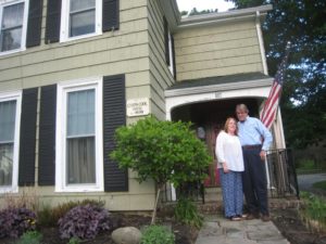 Linda and John Langevin in front of their new home in Agawam, Mass.. Their 1869 Victorian house in Springfield had been severely damaged by the 2011 tornado.
