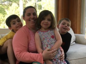 Tracy Carl with three of her four children at their home in Merrimack, NH. (Emily Corwin for NENC and NHPR)